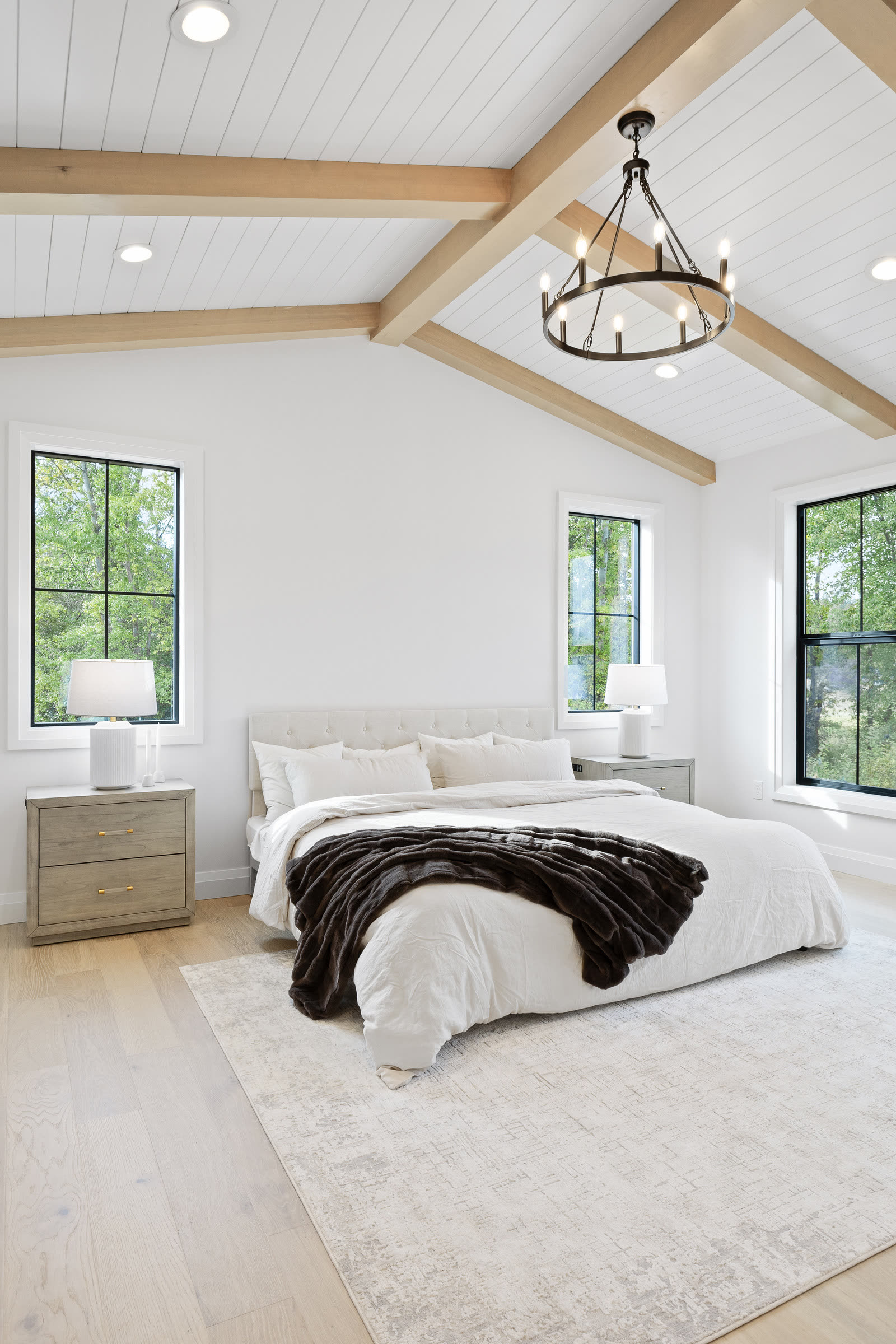 Vaulted bedroom with exposed beams in a mountain home