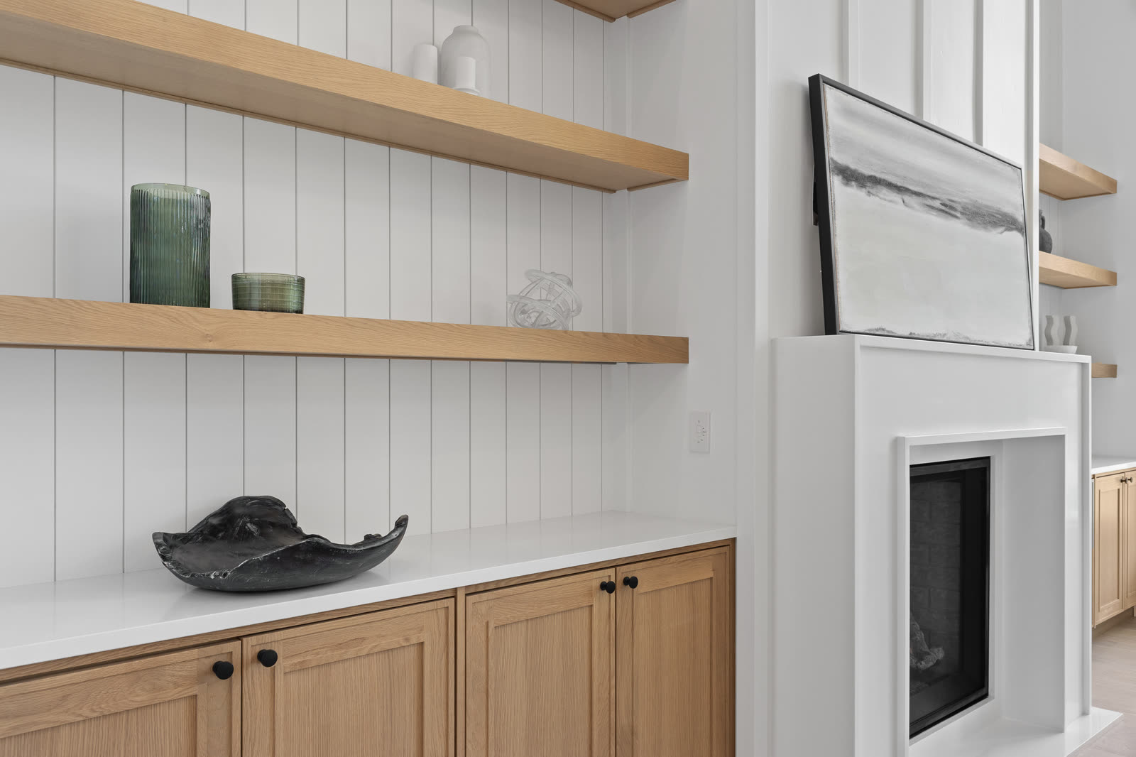 Built-in white oak shelving in a custom home library