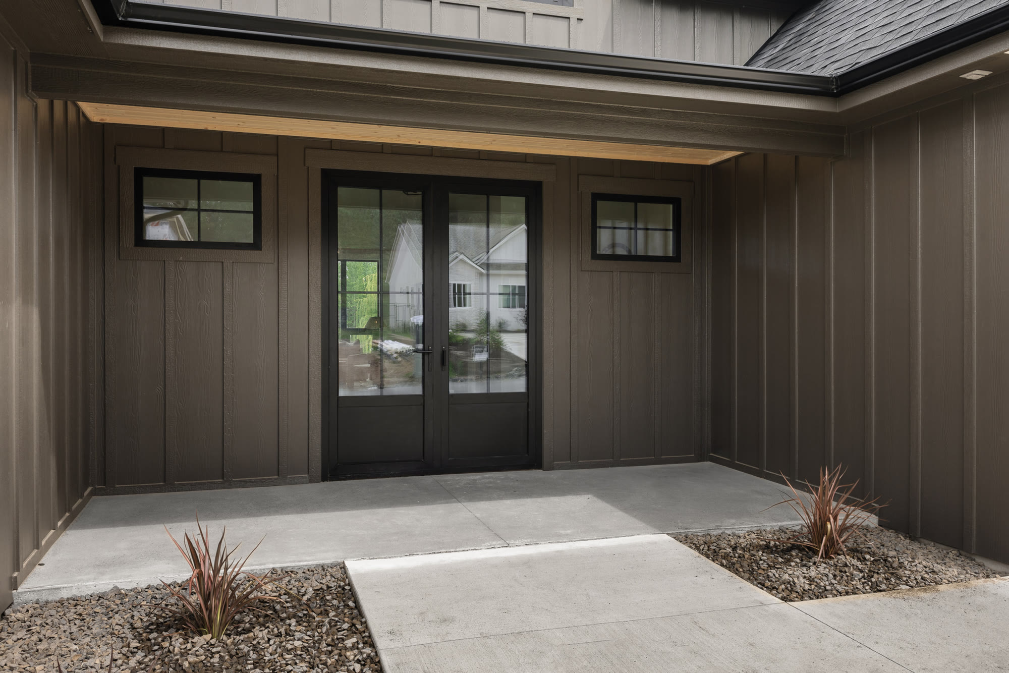 Warmly lit custom home entry at night