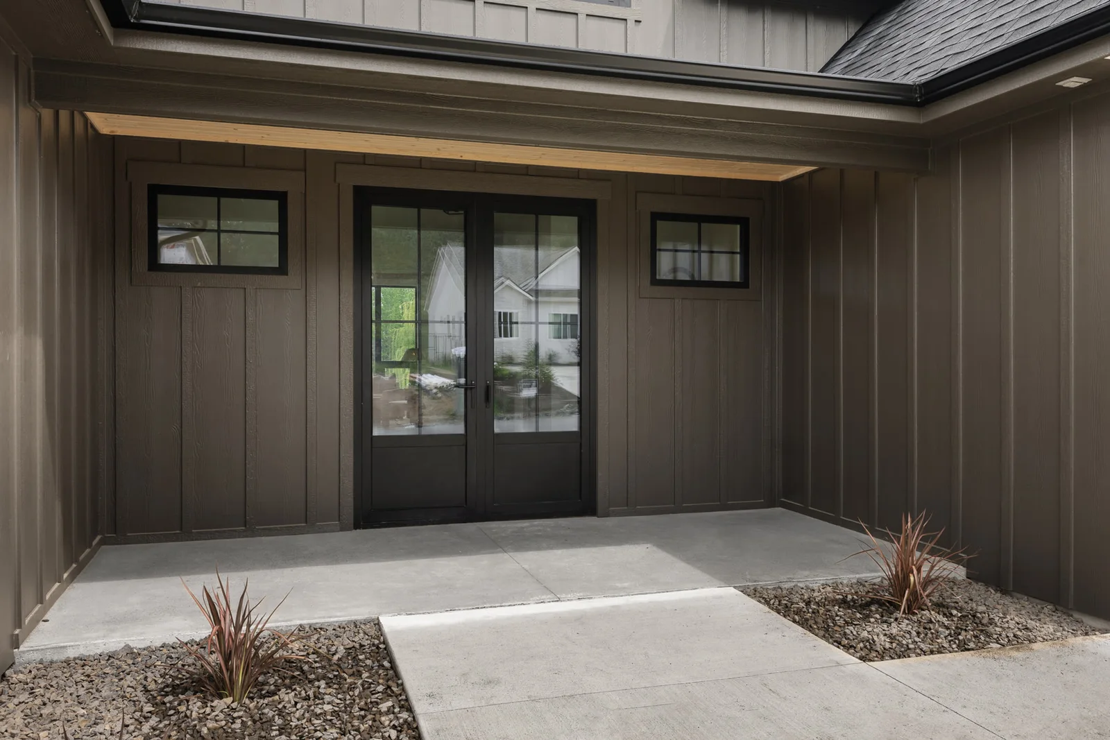 Custom home entry lit at dusk
