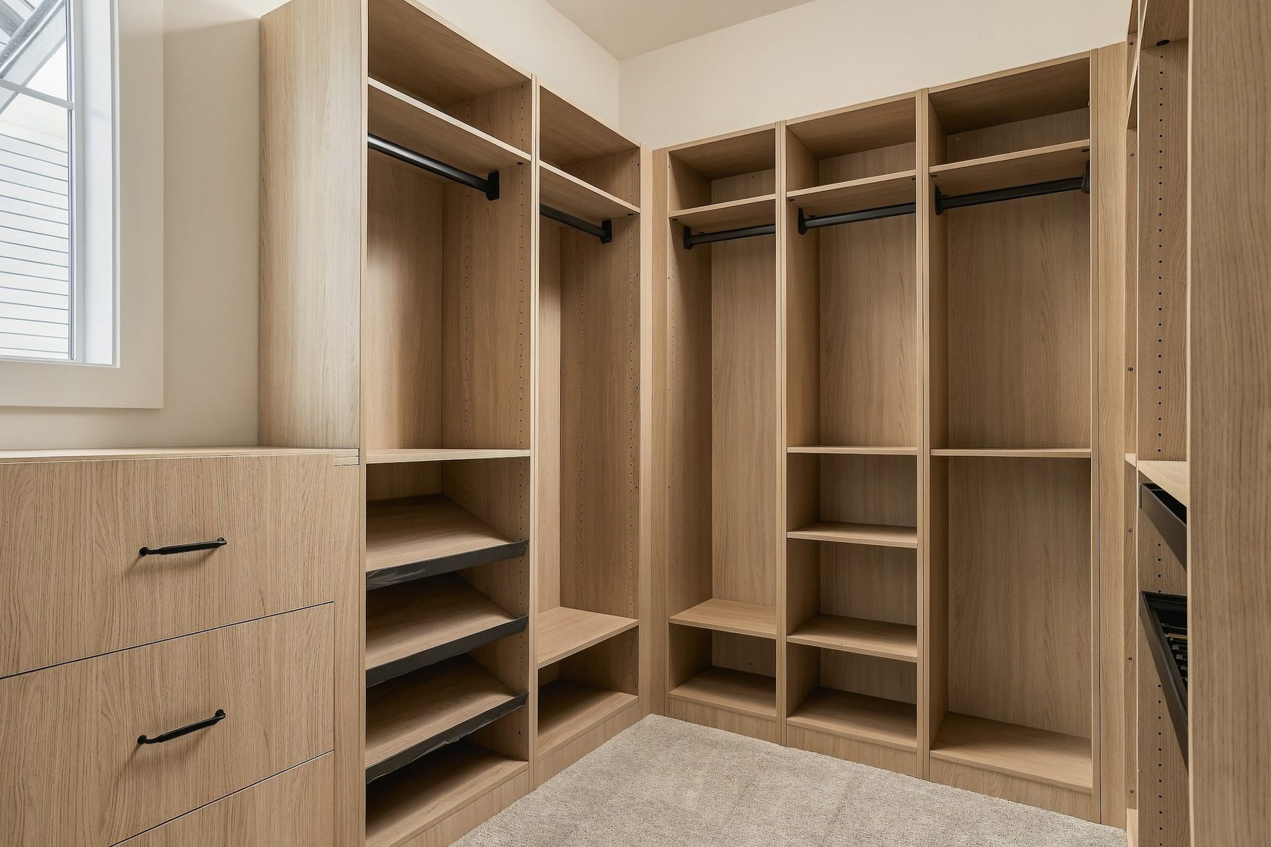 Walk-in closet with custom timber shelving and drawers