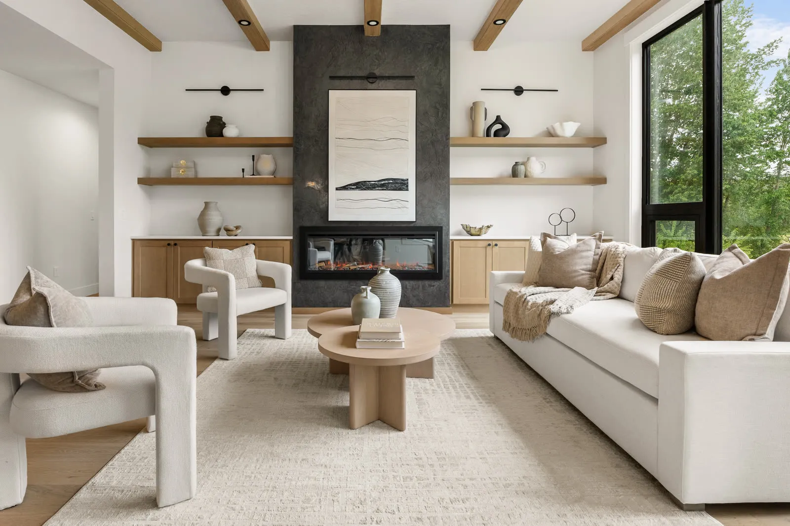 Great room with exposed beams in a custom home