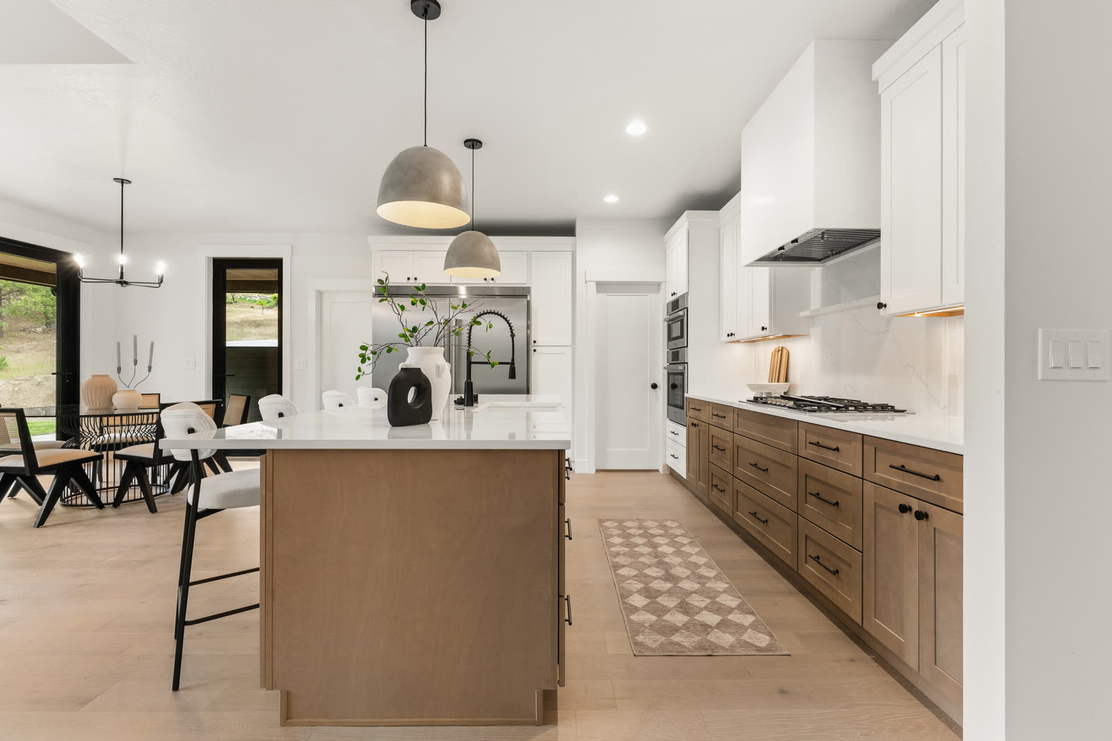 Kitchen island with pendant lighting in a custom home